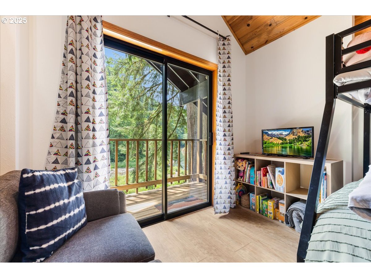 1717 Kalama River Road Kalama, WA 98625 - Photo 17 of 48 a living room with furniture and a flat screen tv