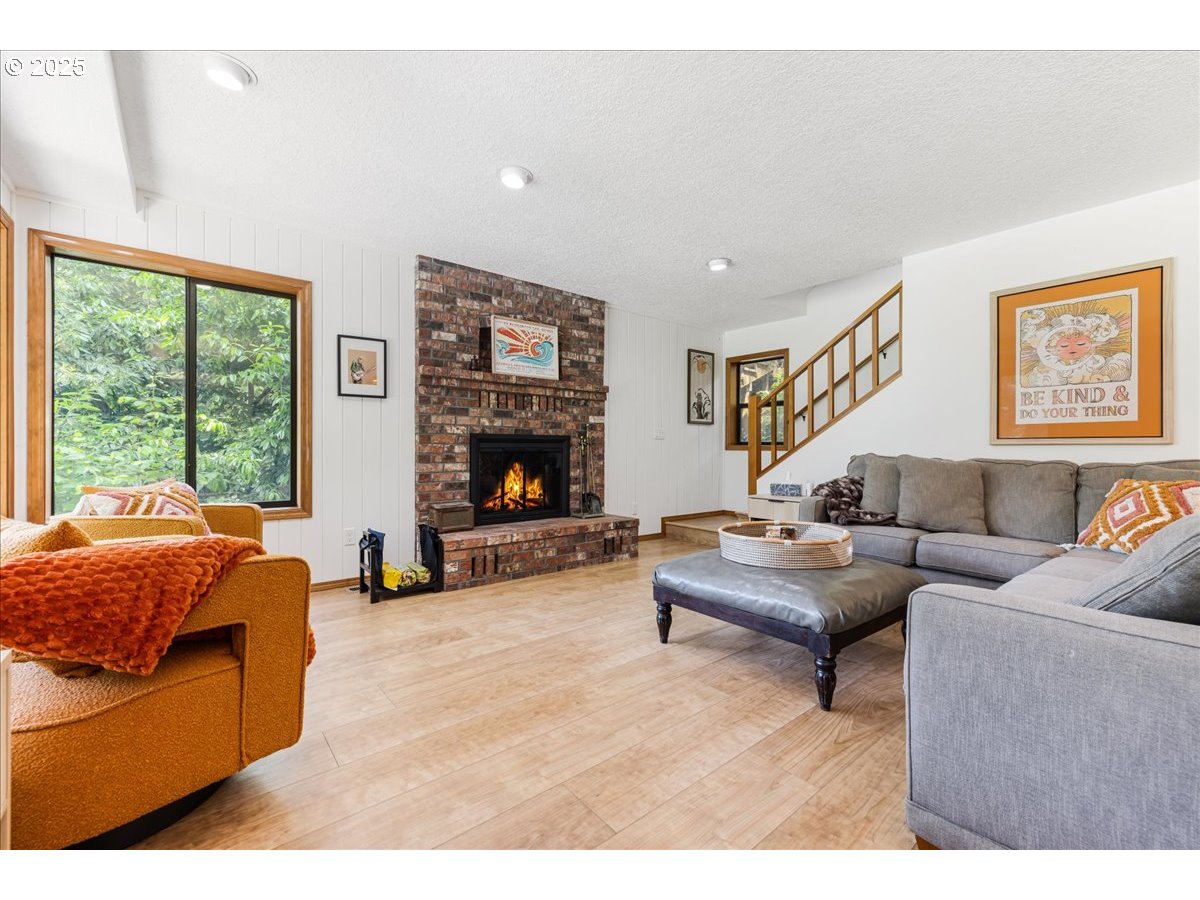 1717 Kalama River Road Kalama, WA 98625 - Photo 21 of 48 a living room with furniture window and a fireplace