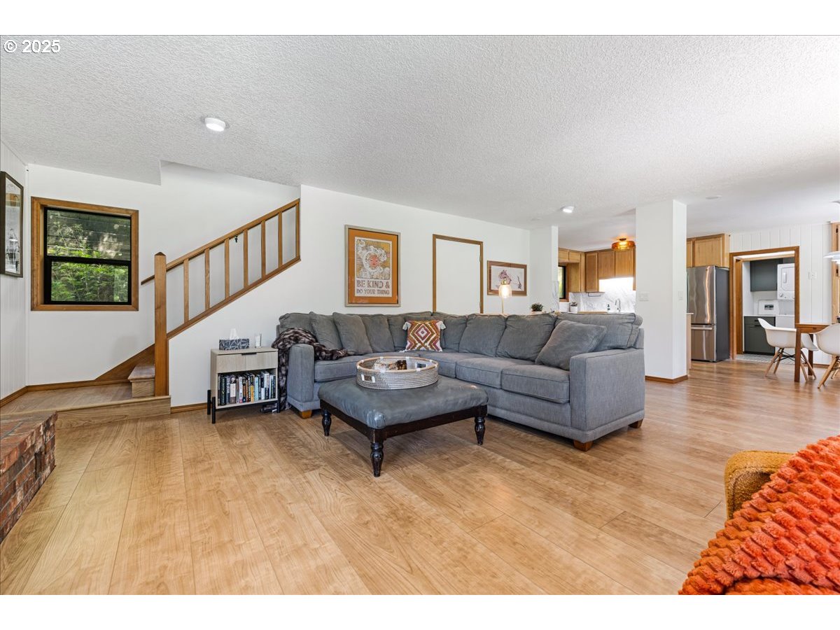 1717 Kalama River Road Kalama, WA 98625 - Photo 22 of 48 a living room with furniture and a wooden floor