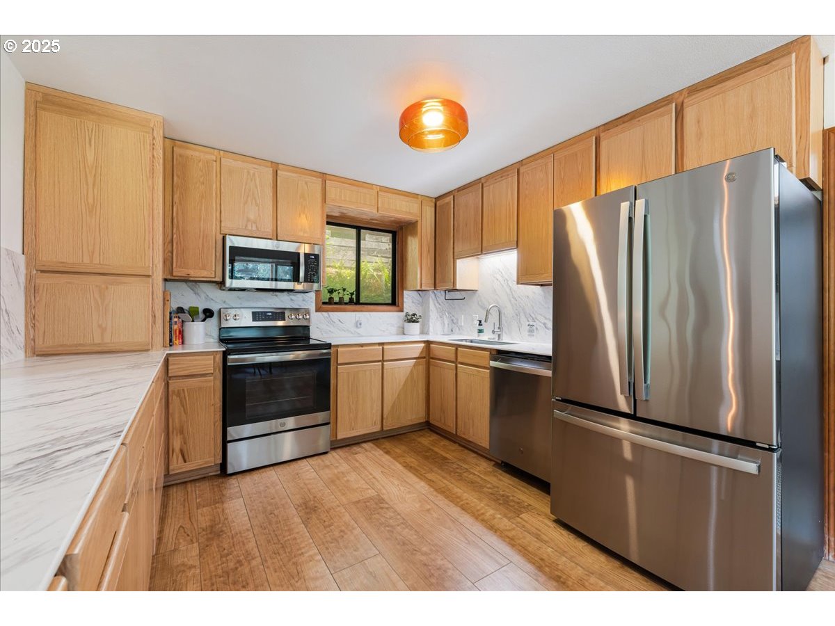 1717 Kalama River Road Kalama, WA 98625 - Photo 30 of 48 a kitchen with a refrigerator sink and microwave