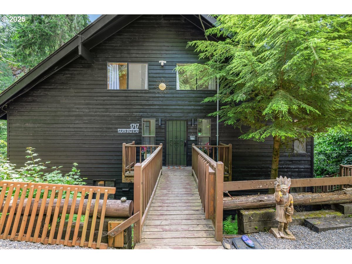 1717 Kalama River Road Kalama, WA 98625 - Photo 3 of 48 a view of house with wooden floor and outdoor seating