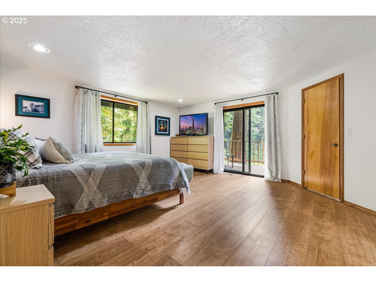 1717 Kalama River Road Kalama, WA 98625 - Photo 10 of 48 a bedroom with a bed and a large window