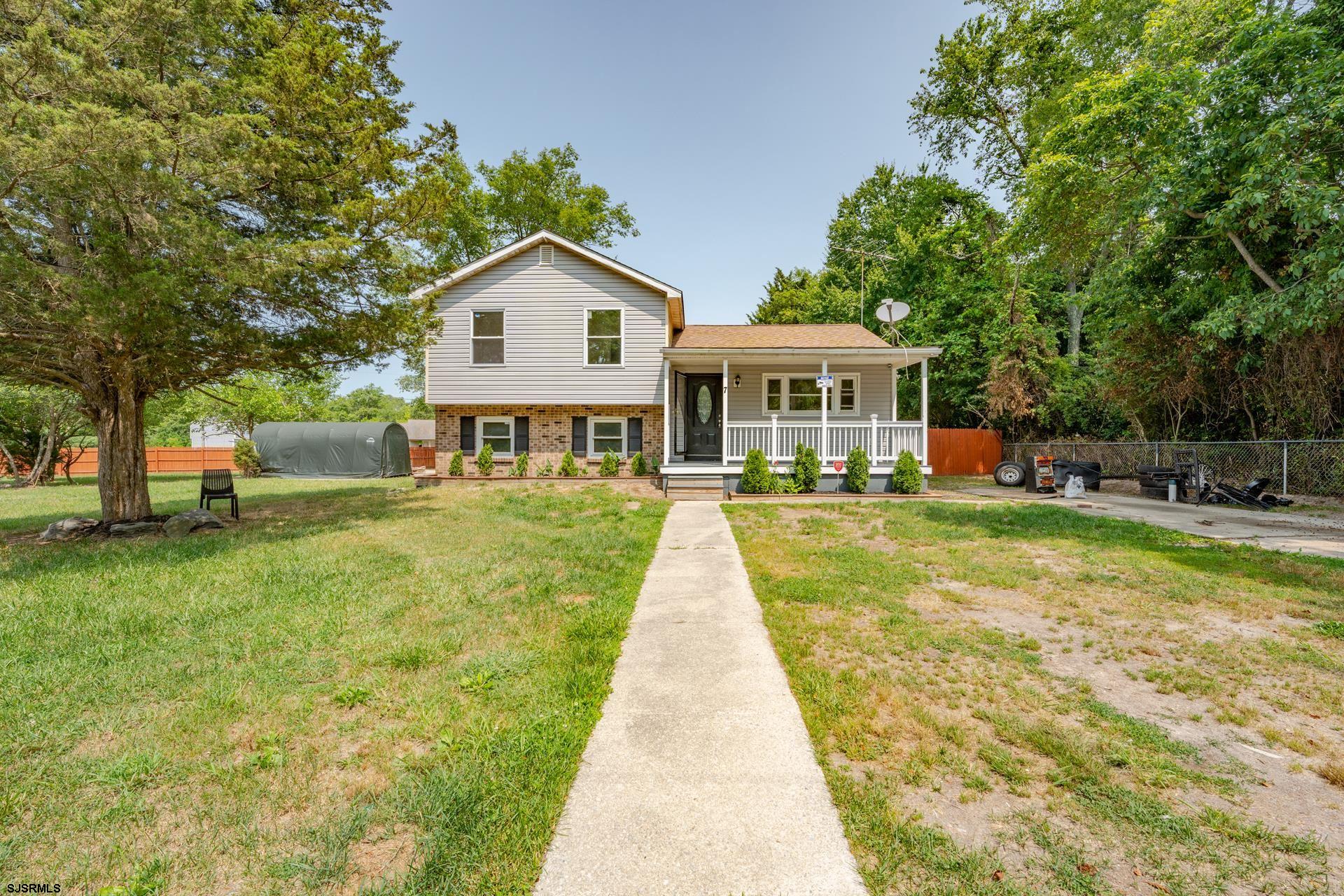 7 Folson Road Millville, NJ 08332 - Photo 1 of 41 a front view of a house with a yard table and chairs