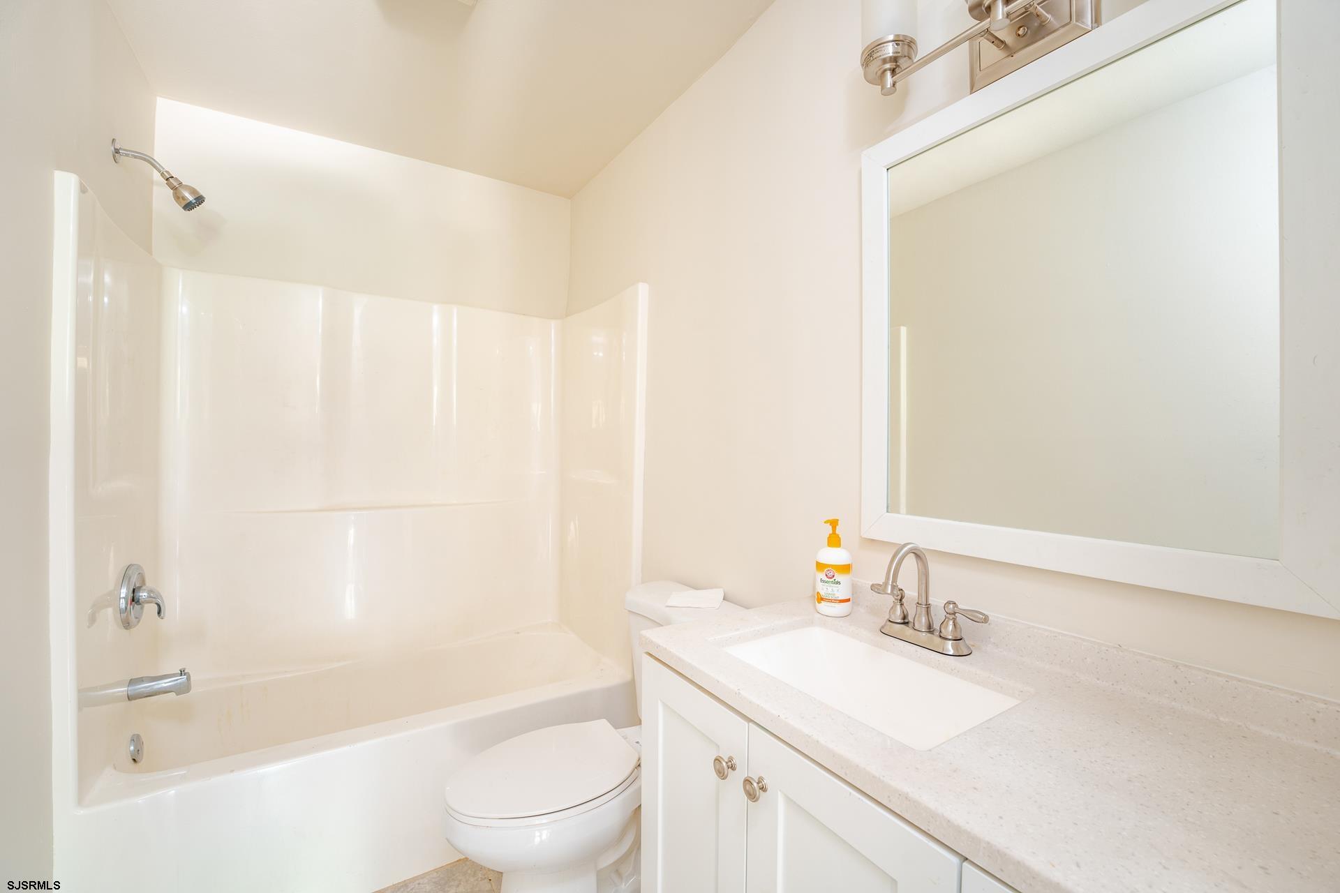7 Folson Road Millville, NJ 08332 - Photo 22 of 41 a bathroom with a granite countertop sink a toilet and shower