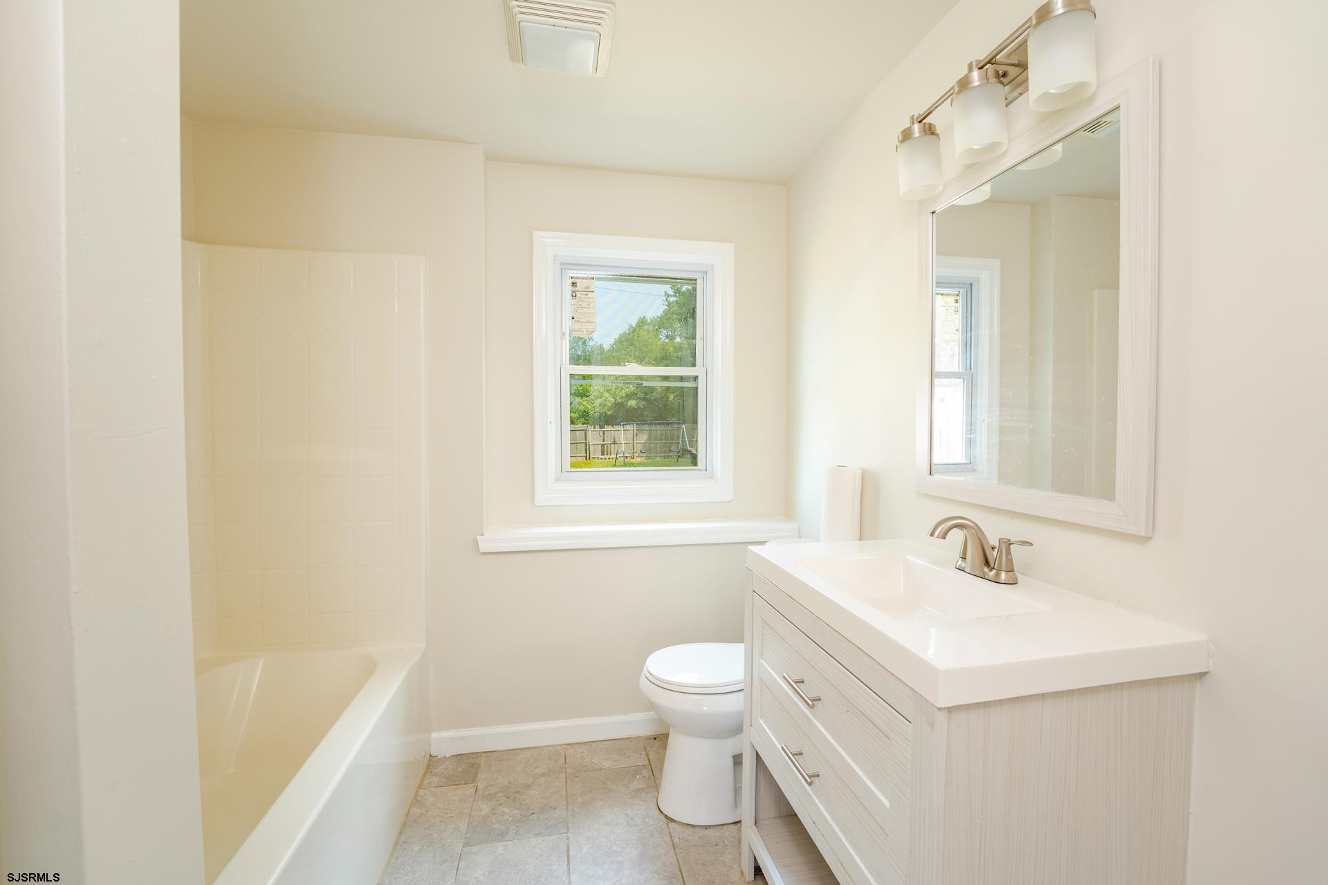 7 Folson Road Millville, NJ 08332 - Photo 23 of 41 a bathroom with a sink a toilet and shower