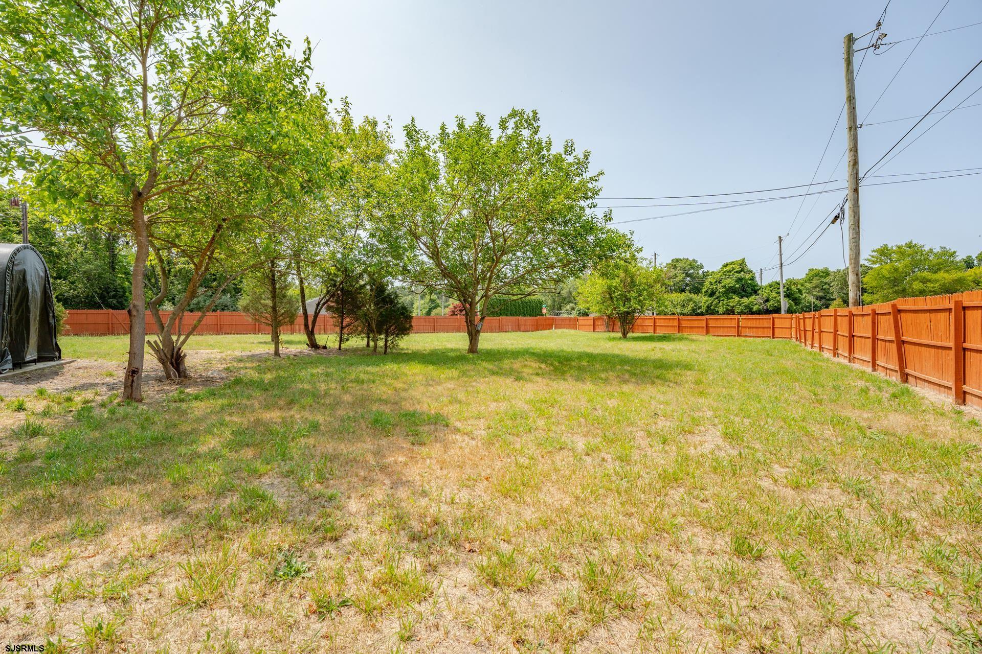 7 Folson Road Millville, NJ 08332 - Photo 31 of 41 a view of yard with swimming pool and trees