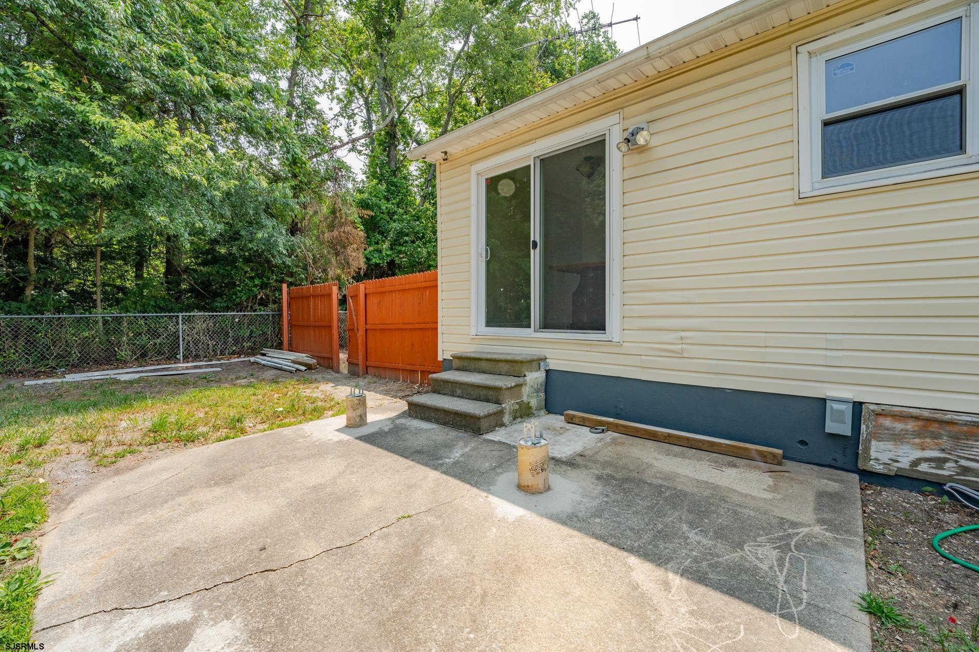 7 Folson Road Millville, NJ 08332 - Photo 39 of 41 a view of a backyard with a large pool and sitting area