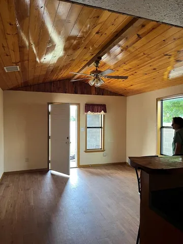 a view of livingroom with furniture and window
