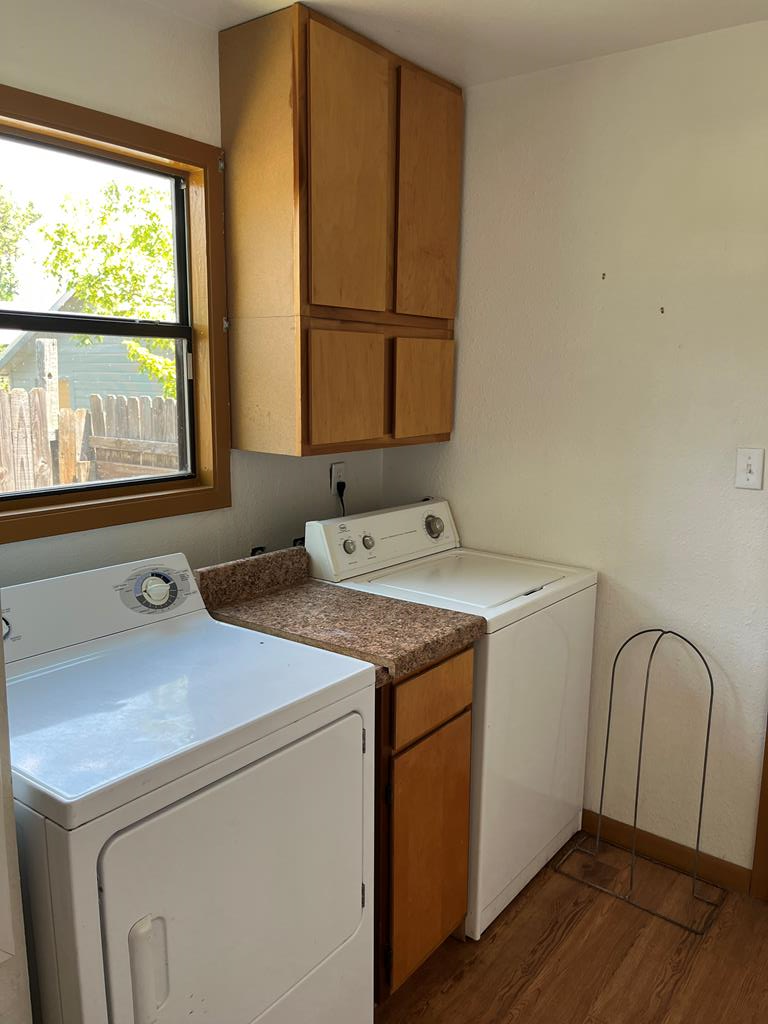 303 B 1st St Center Point Center Point, TX 78010 - Photo 8 of 11 a utility room with dryer and window