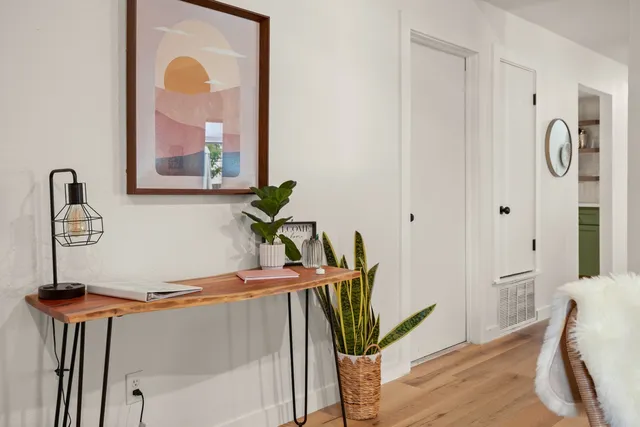 a bedroom with a bed and a lamp