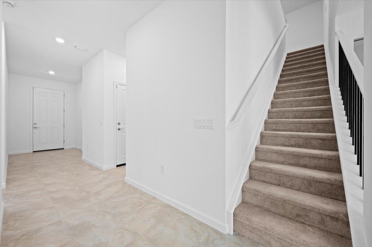 9915 Southwest Meridian Way Stuart, FL 34997 - Photo 20 of 32 Staircase to 2nd/3rd Bedroom/Loft