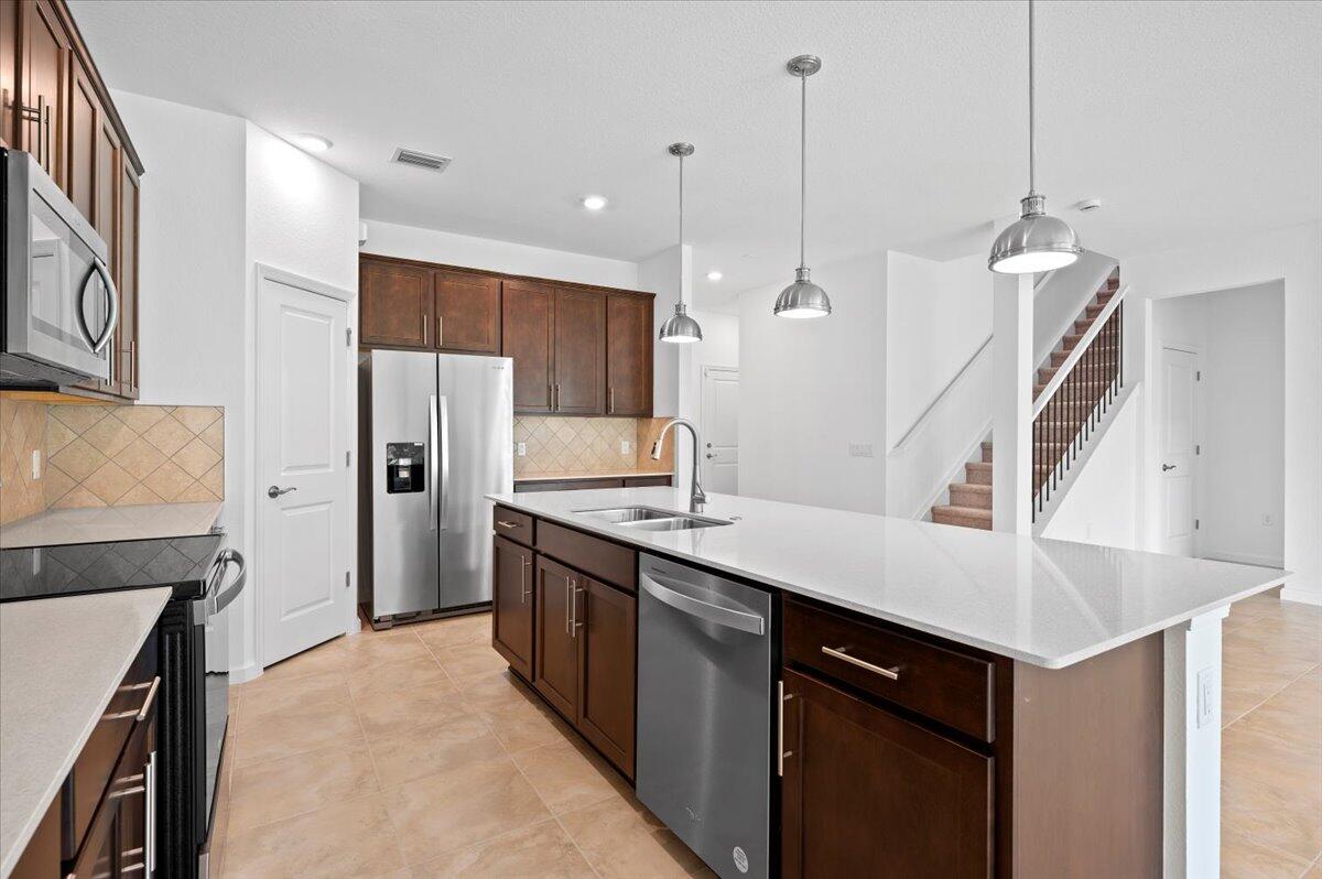 9915 Southwest Meridian Way Stuart, FL 34997 - Photo 6 of 32 Open Modern Kitchen