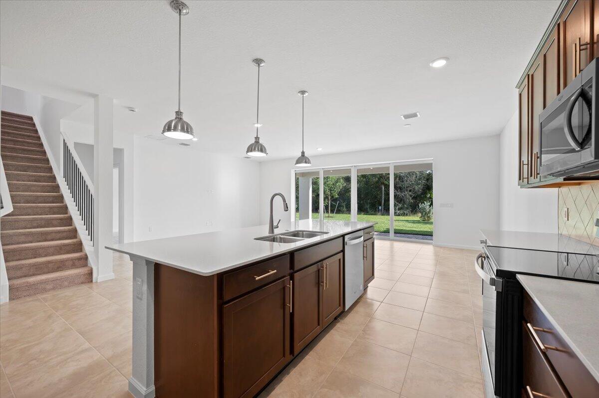 9915 Southwest Meridian Way Stuart, FL 34997 - Photo 7 of 32 Open Modern Kitchen & Breakfast Area