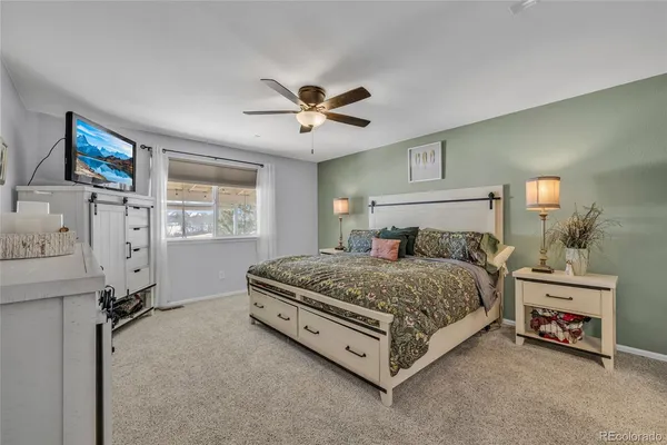 a bedroom with a bed dresser and a window