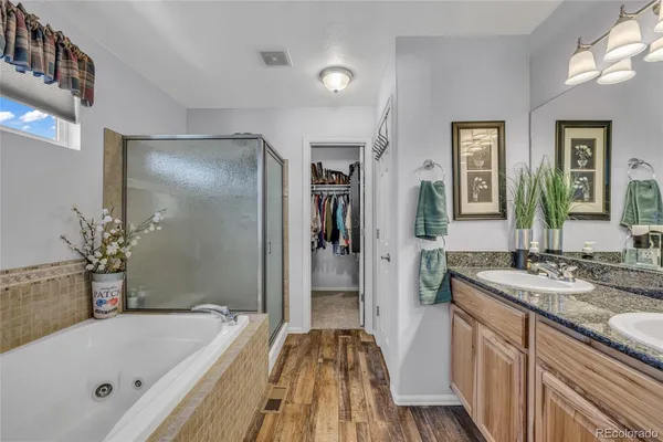 a bathroom with a bathtub and a sink