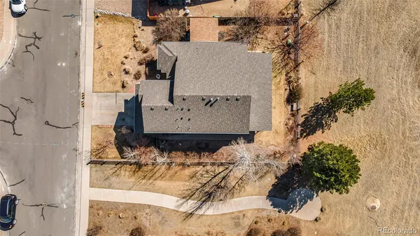 a view of a house with snow on the side of it