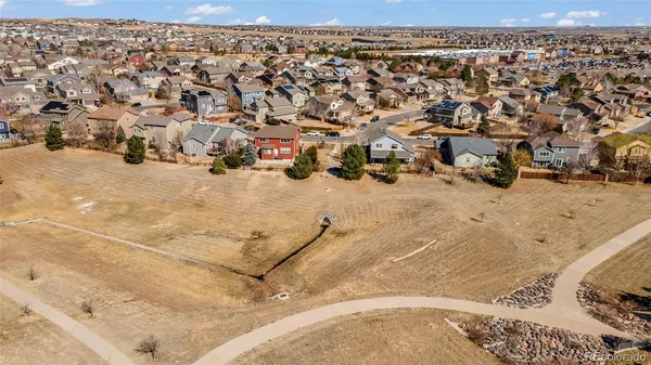 a wooden bench sitting in front of a building