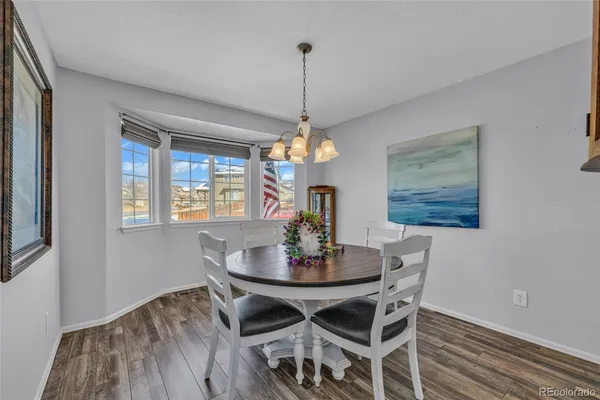 a dining room with a table and chairs