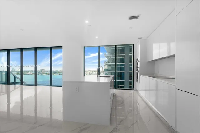 a bathroom with a toilet sink vanity and mirror