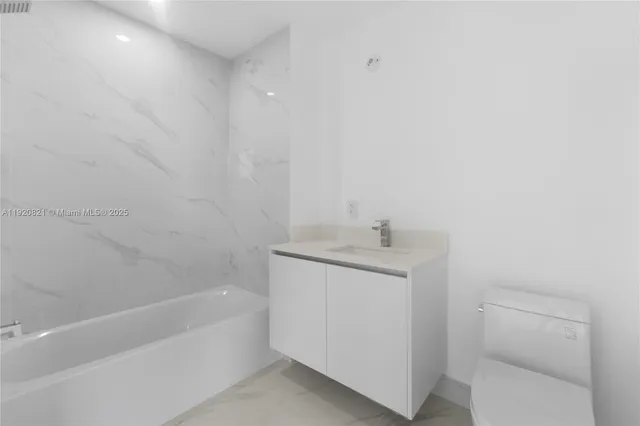 a view of an entryway with a floor to ceiling window