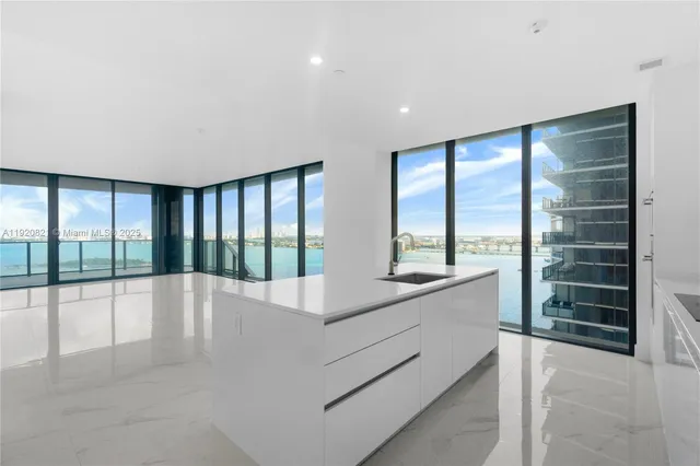 a view of kitchen with furniture and cabinets