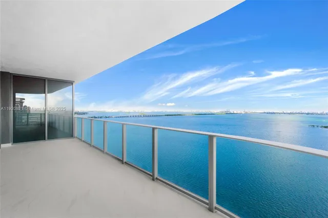 a view of water heater room with wooden floor