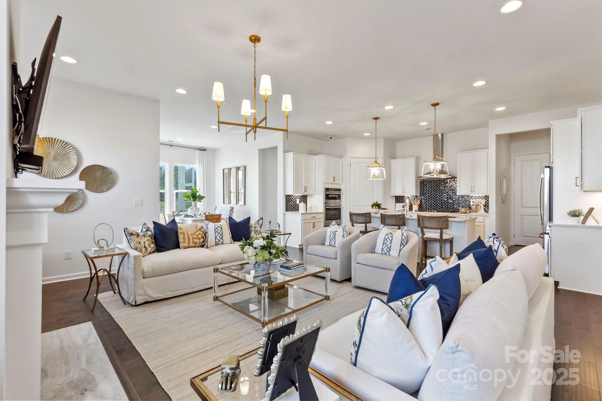 5068 Duval Circle Tega Cay, SC 29708 - Photo 12 of 41 a living room with furniture kitchen view and a chandelier