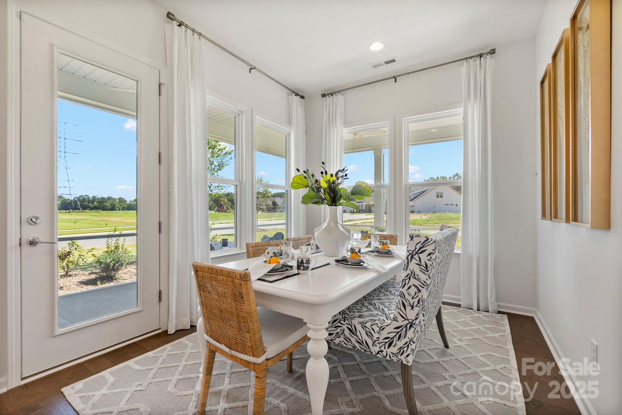 5068 Duval Circle Tega Cay, SC 29708 - Photo 15 of 41 a view of a dining room with furniture window and wooden floor