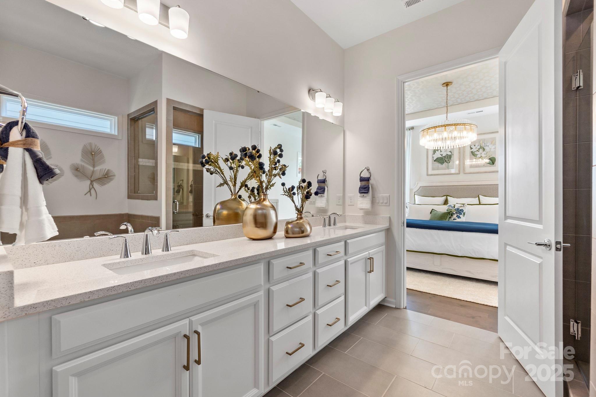5068 Duval Circle Tega Cay, SC 29708 - Photo 21 of 41 a bathroom with a double vanity sink and a mirror
