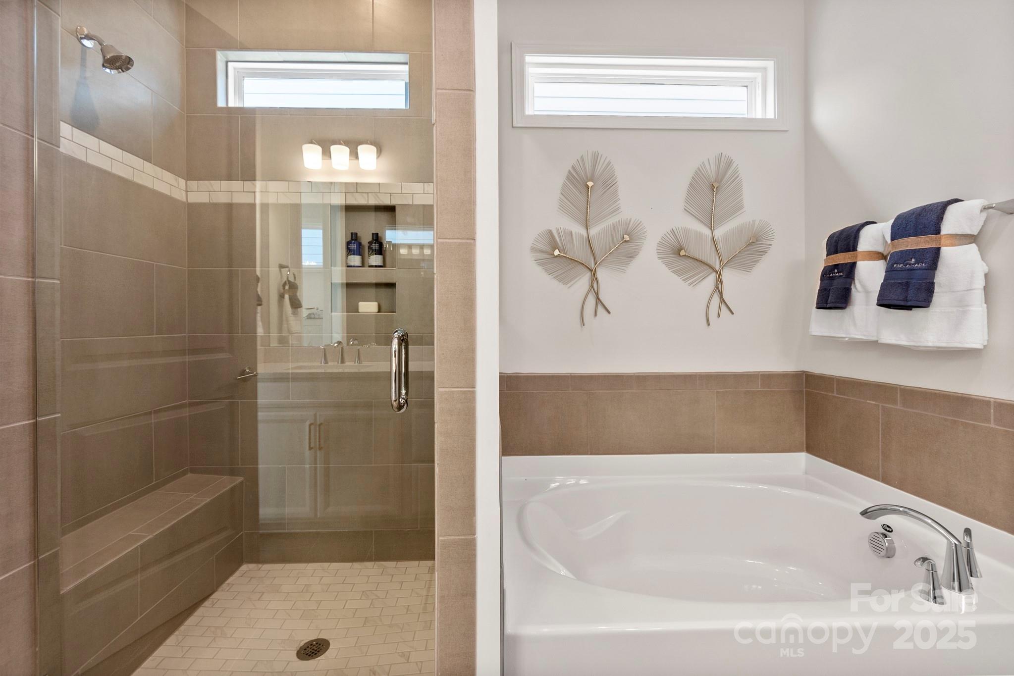 5068 Duval Circle Tega Cay, SC 29708 - Photo 22 of 41 a bathroom with a bathtub and shower