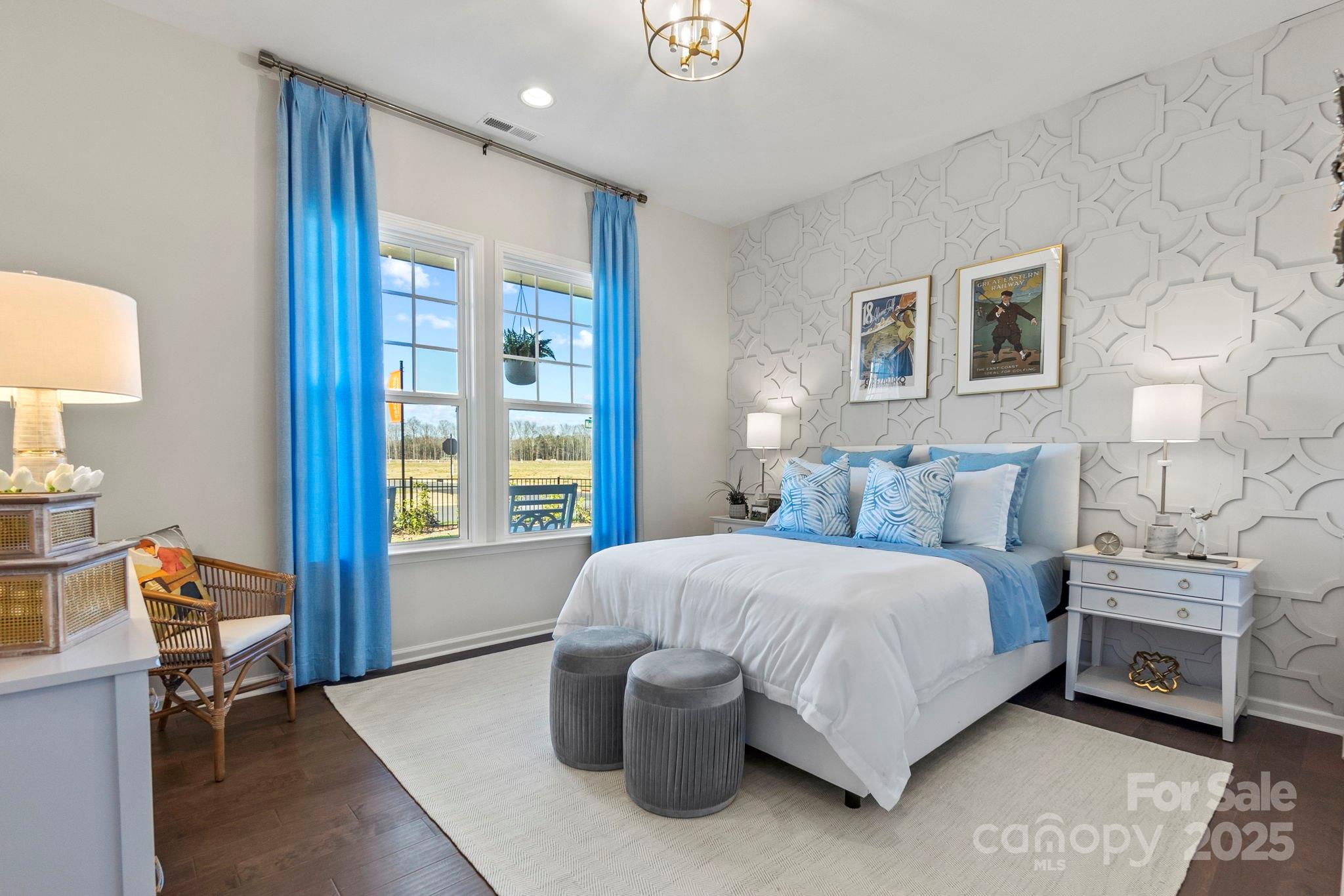 5068 Duval Circle Tega Cay, SC 29708 - Photo 23 of 41 a bedroom with a bed and a lamp on table