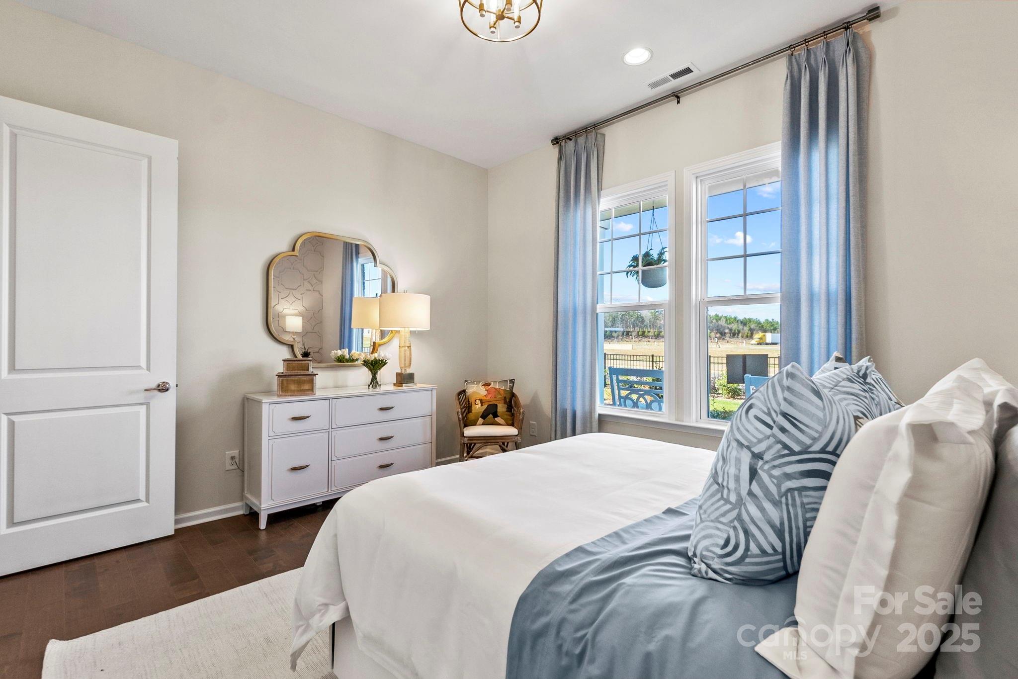 5068 Duval Circle Tega Cay, SC 29708 - Photo 24 of 41 a bedroom with a bed and a dresser