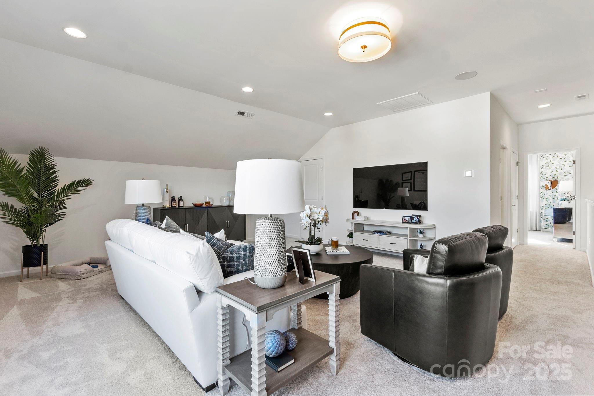 5068 Duval Circle Tega Cay, SC 29708 - Photo 29 of 41 a living room with furniture and a flat screen tv