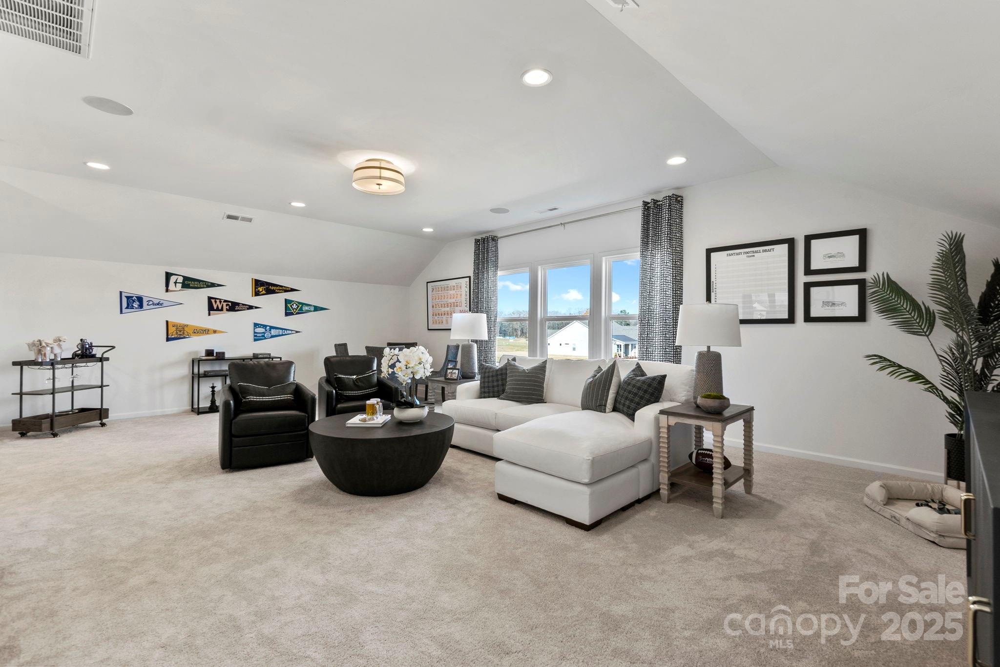 5068 Duval Circle Tega Cay, SC 29708 - Photo 30 of 41 a living room with furniture and a flat screen tv