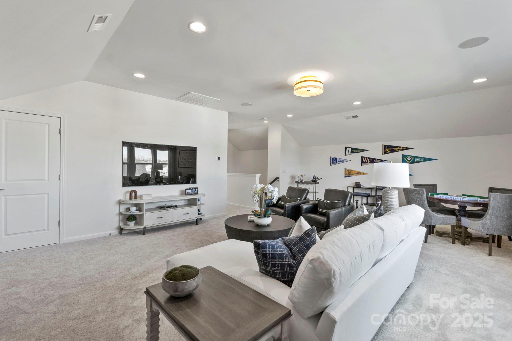 5068 Duval Circle Tega Cay, SC 29708 - Photo 31 of 41 a living room with furniture and a flat screen tv