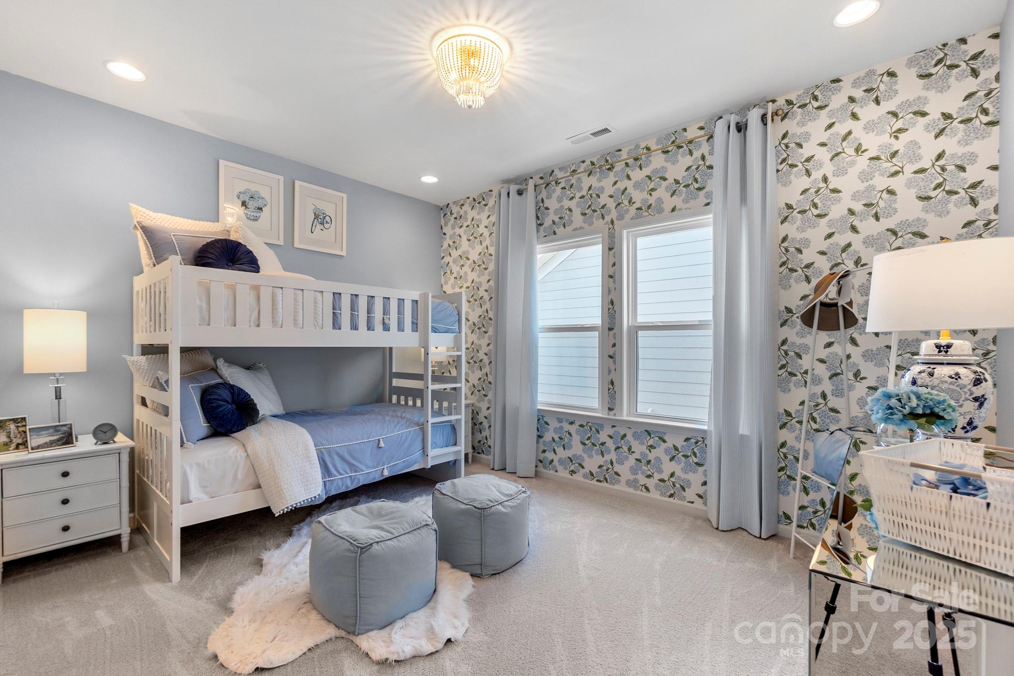 5068 Duval Circle Tega Cay, SC 29708 - Photo 33 of 41 a bedroom with furniture and a large window