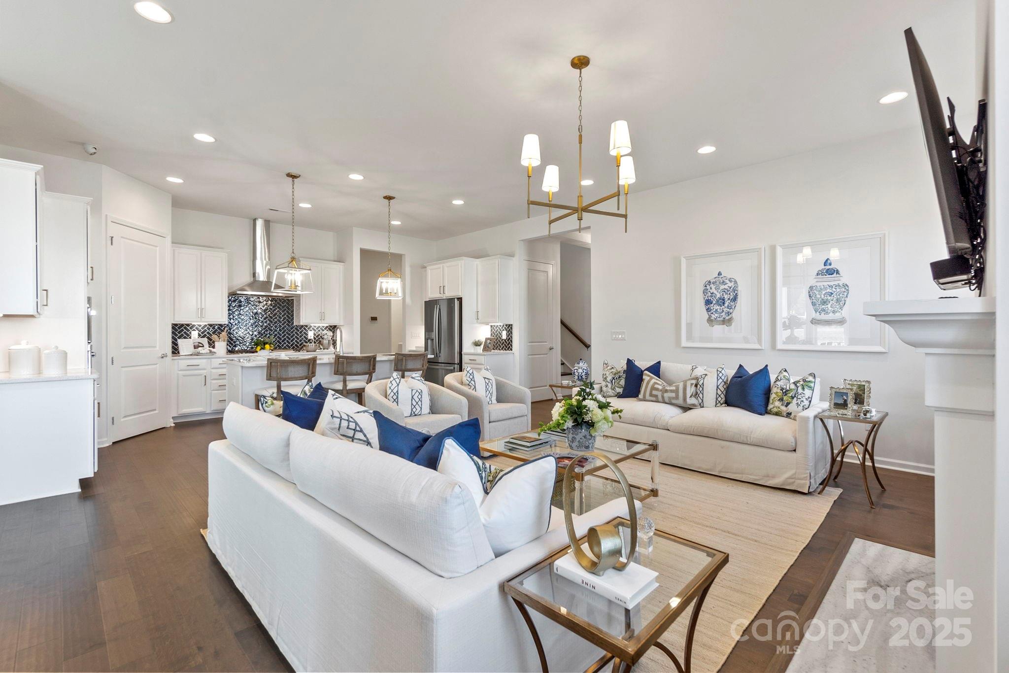 5068 Duval Circle Tega Cay, SC 29708 - Photo 10 of 41 a living room with furniture kitchen and a chandelier