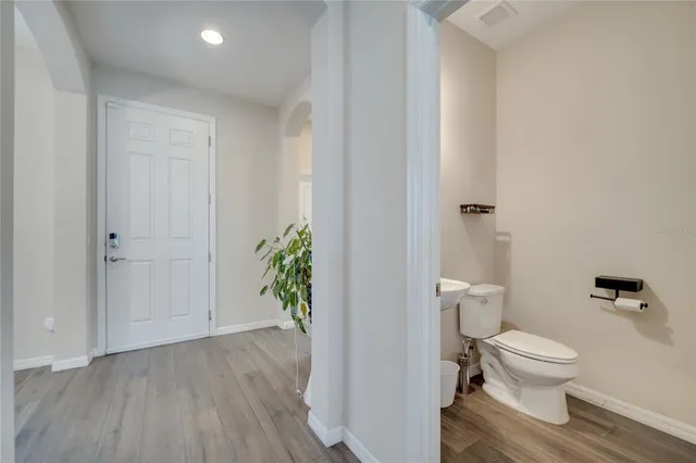 a living room with furniture a window and a flat screen tv