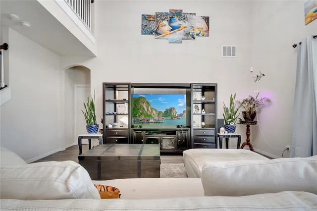 a kitchen with stainless steel appliances a refrigerator sink and cabinets