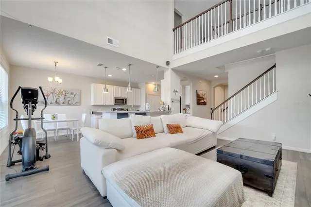 a bathroom with a tub a sink and a mirror