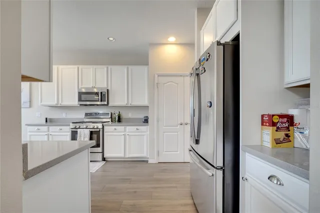 a living room with furniture a window and gym equipment