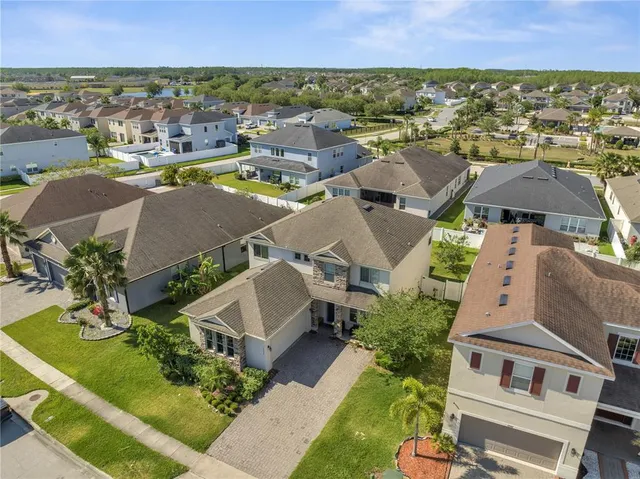 an aerial view of residential houses with outdoor space