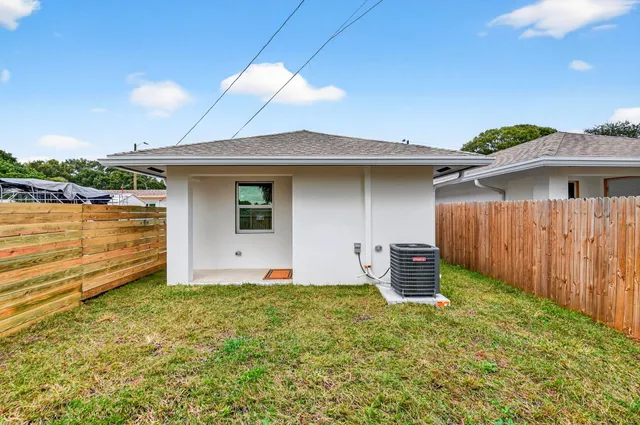 a view of a backyard of the house