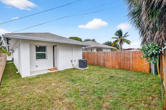 a backyard of a house with lots of green space