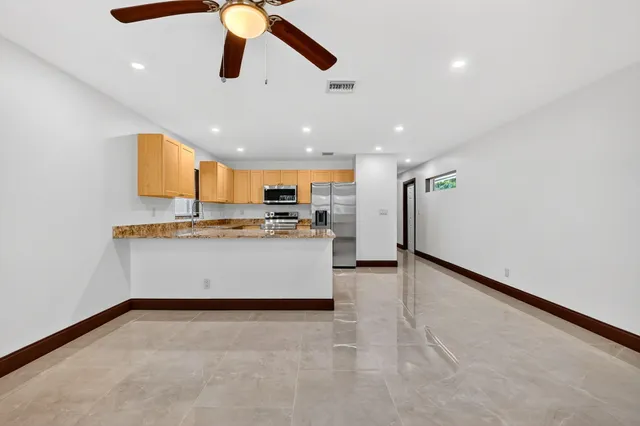 a view of counter top with ceiling fan