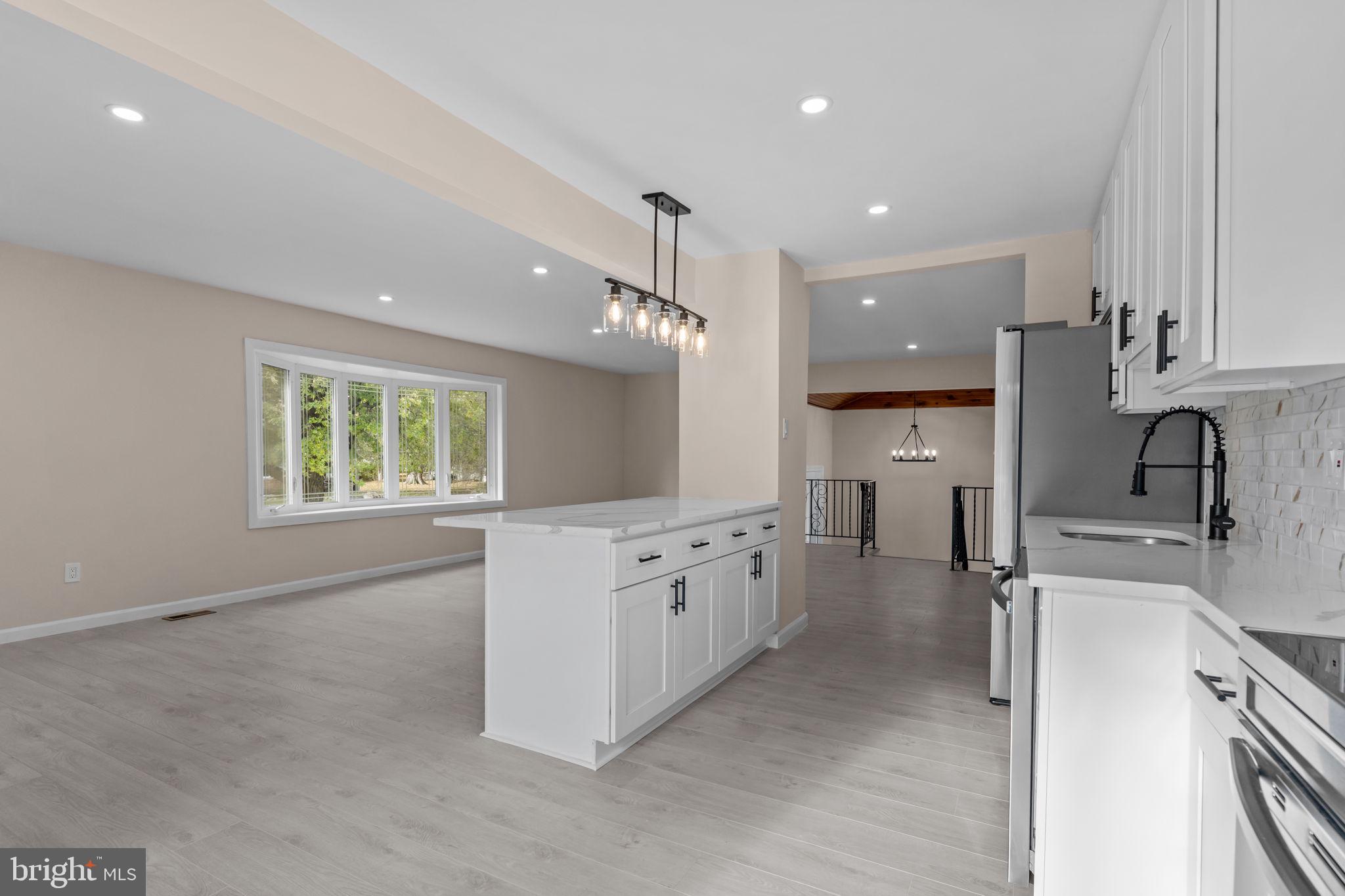 100 East Endfield Road Feasterville-Trevose, PA 19053 - Photo 13 of 53 a kitchen with granite countertop white cabinets and white appliances