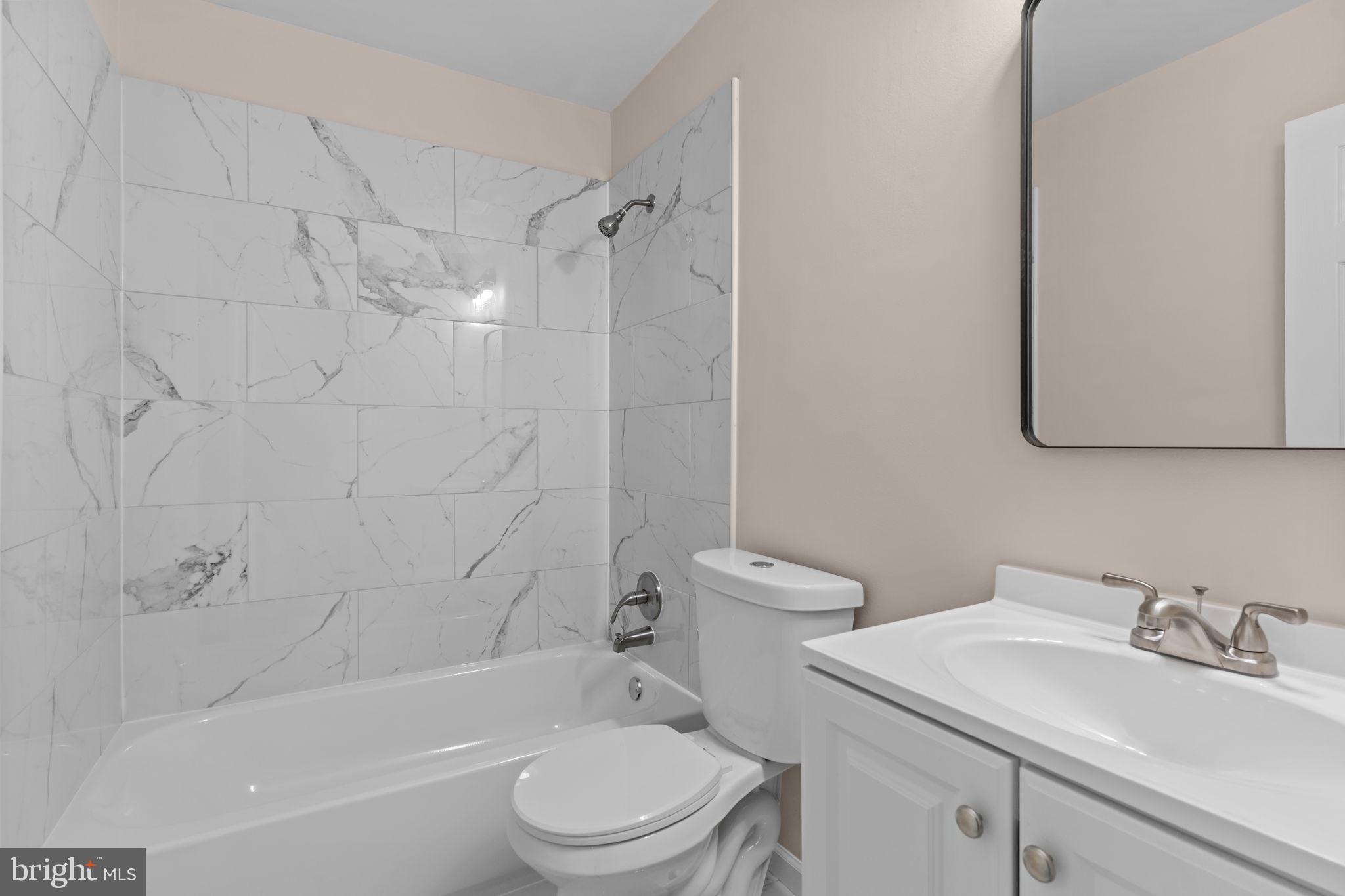 100 East Endfield Road Feasterville-Trevose, PA 19053 - Photo 19 of 53 a bathroom with a sink toilet vanity and shower