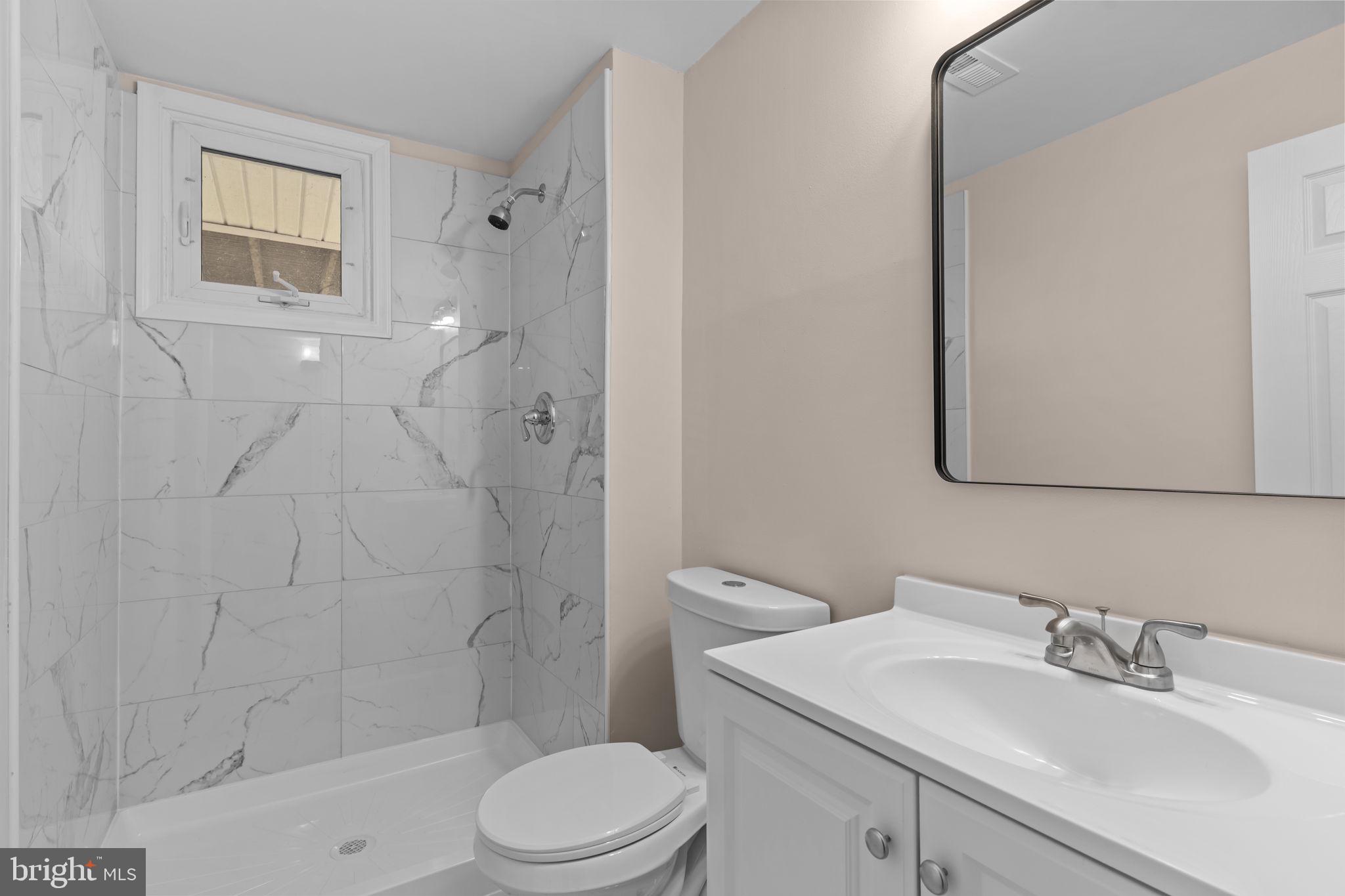 100 East Endfield Road Feasterville-Trevose, PA 19053 - Photo 33 of 53 a bathroom with a sink a toilet and shower