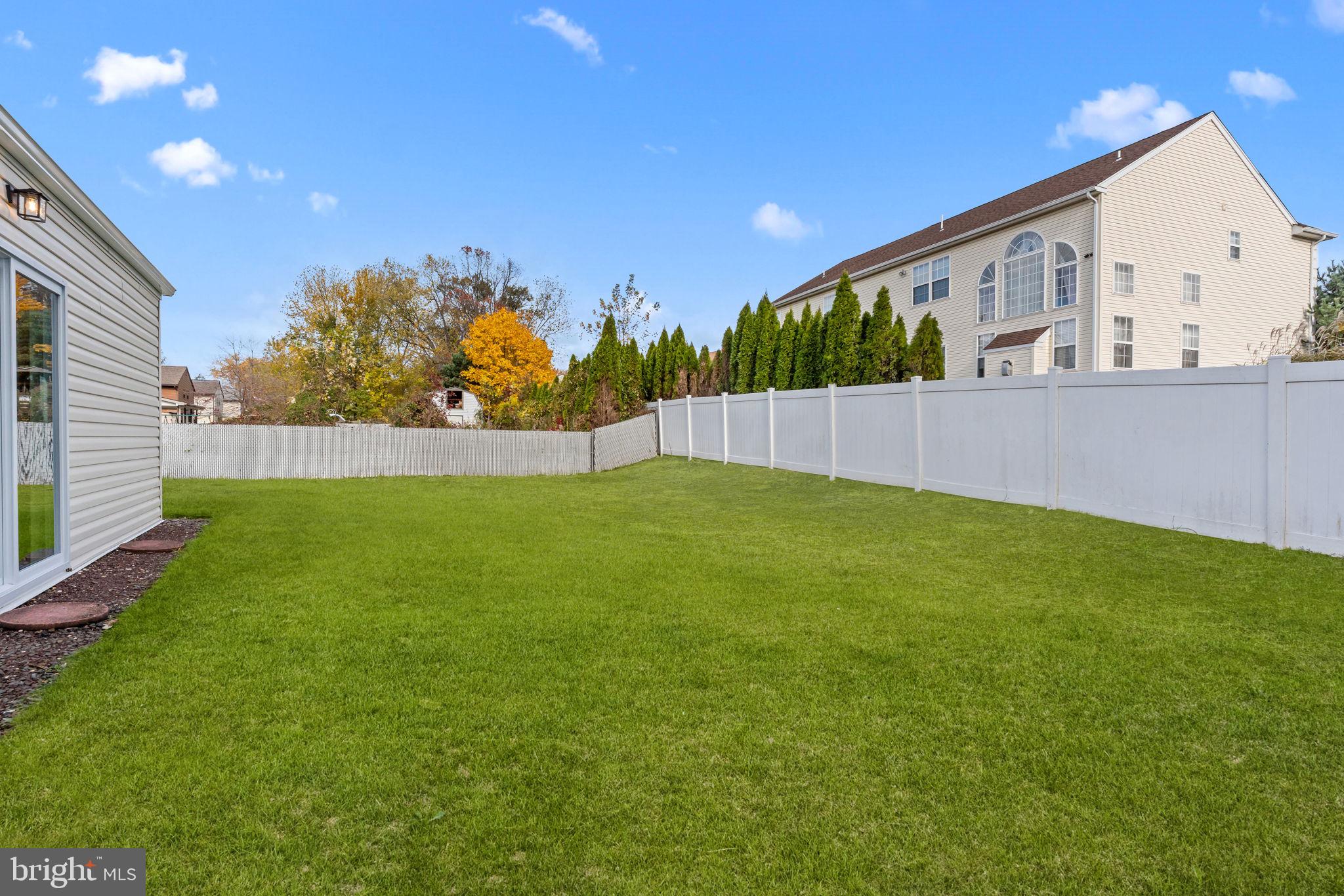 100 East Endfield Road Feasterville-Trevose, PA 19053 - Photo 41 of 53 a view of backyard with large tree and wooden fence