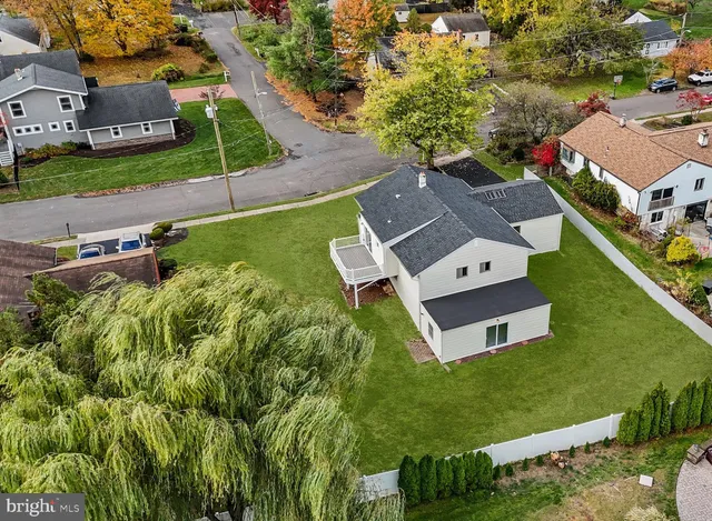 an aerial view of a house with a garden
